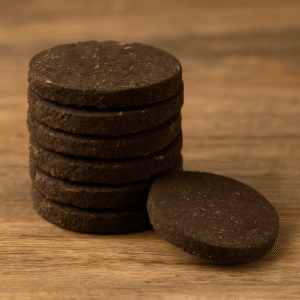 A stack of round, compressed cow dung discs used for Hindu rituals and traditional puja ceremonies.