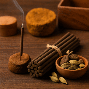 Natural cow dung-based incense sticks and dhoop cones placed on a rustic surface, showcasing eco-friendly and spiritual Indian aromatic products.