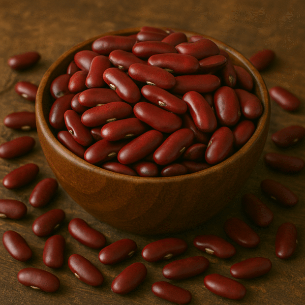A wooden bowl filled with Rajma (red kidney beans) placed on a rustic wooden background, with beans scattered around for a natural and organic presentation.
